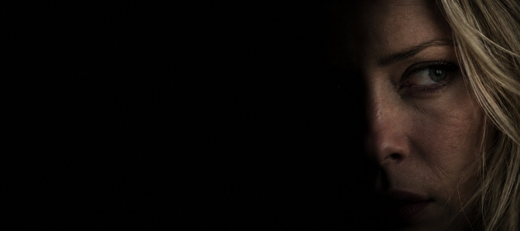 One of Susie’s eyes emerges from deep shadow